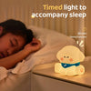 Cute puppy silicone night lamp glowing warmly on a table