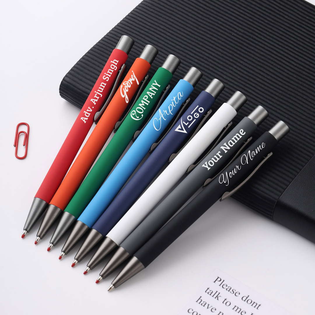 Set of personalized pens with various colors and branding on a white surface.