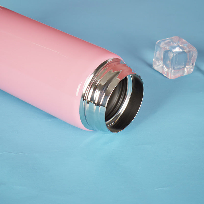 Adorable pastel-pink stainless steel bottle with kitty illustrations and a leak-proof flip-top lid, ideal for hot and cold beverages.