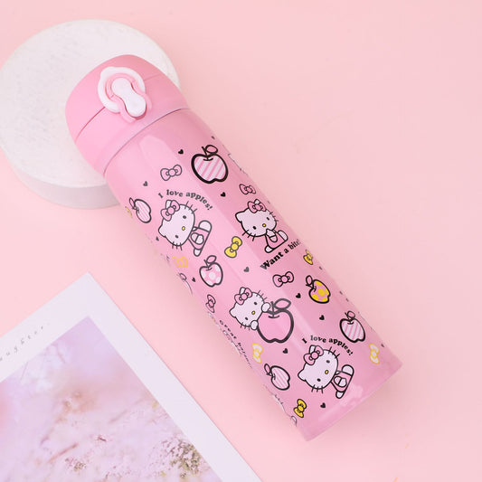 A pink stainless steel water bottle with cute kitty prints, hearts, and bows, placed on a blue table against a pink background.