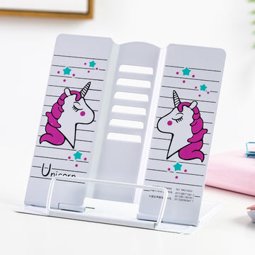 Cute unicorn-themed adjustable metal book stand with pink and teal star design on a white background.