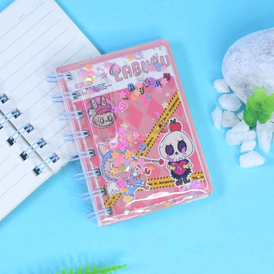 Cute monster-themed spiral notebook for kids with water-filled glitter design.
