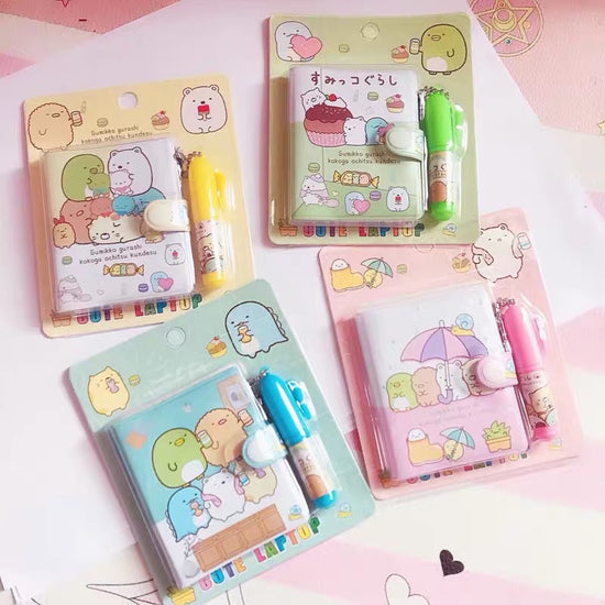mini cartoon diary and pen set for kids in assorted pastel colors.