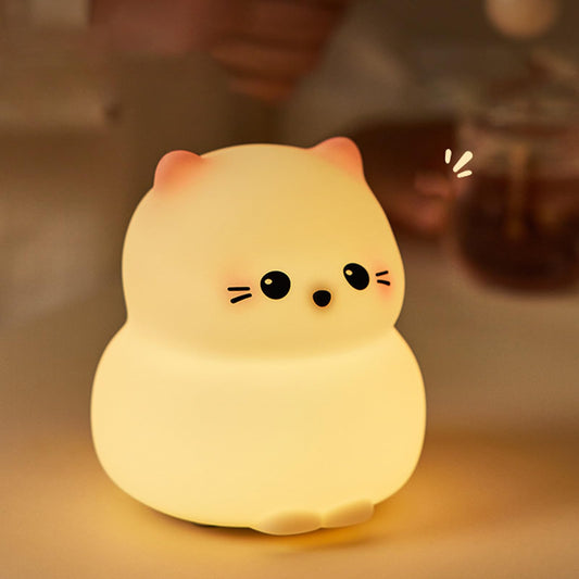 Cute guardian kitty silicone night lamp glowing softly on a table