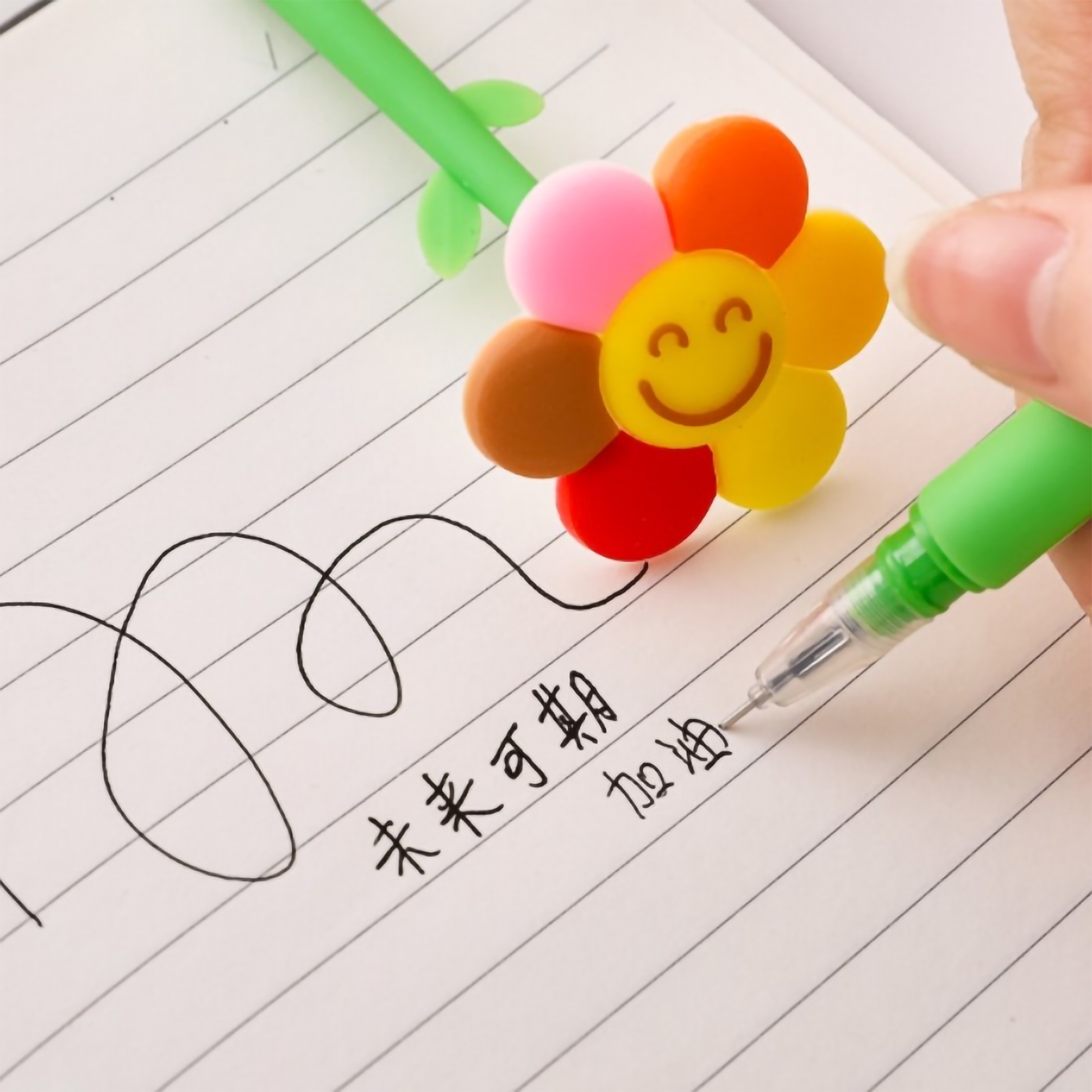 Close-up shot of a hand writing on lined paper using the green stem flower gel pen.