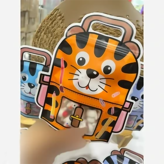 Close-up of the frosted transparent pocket window and tiger design on a school bag style pouch.