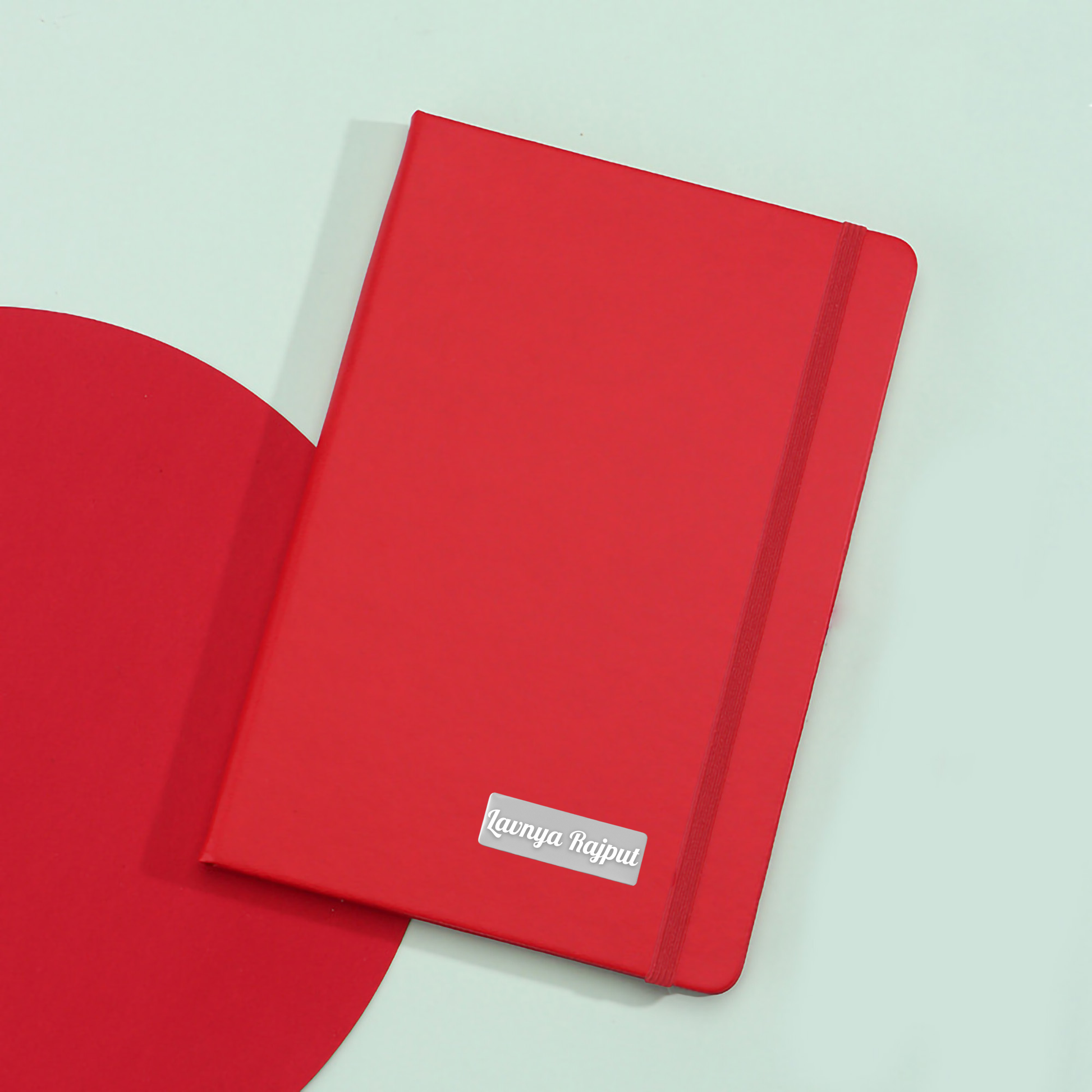 Closed red personal diary showing smooth cover texture for custom printing.