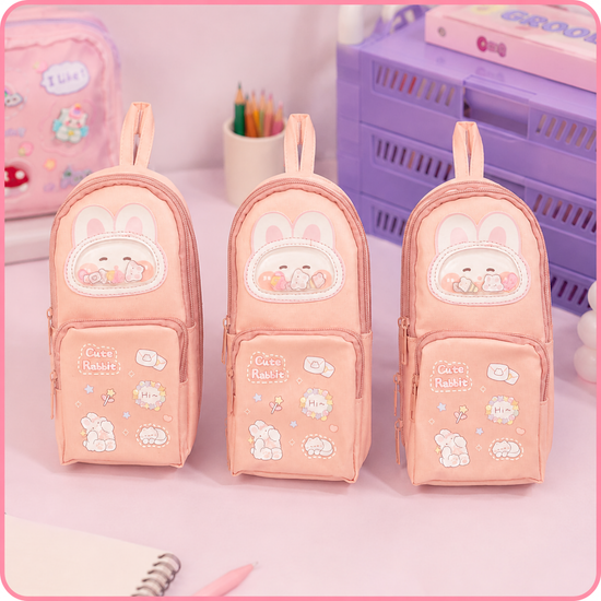 Three identical aesthetic Korean style pink rabbit school pencil storage bags lined up on display.