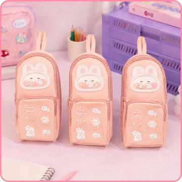 Three identical aesthetic Korean style pink rabbit school pencil storage bags lined up on display.