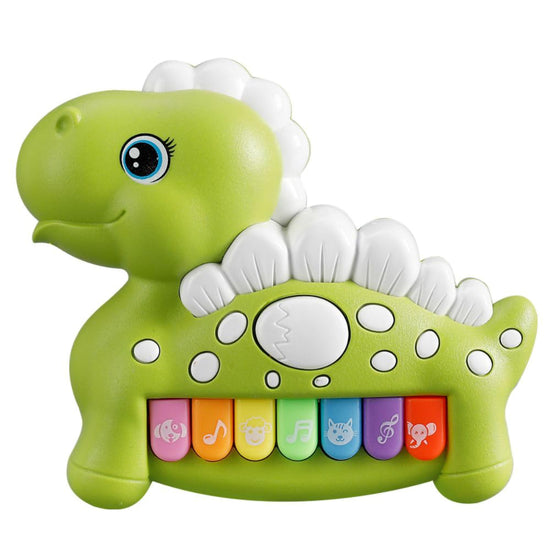 Close-up of the light-up piano keys on a green dinosaur toy showing musical icons.