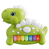 Close-up of the light-up piano keys on a green dinosaur toy showing musical icons.