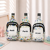 Three custom name kids' sling bags displayed side-by-side on a surface, featuring sports, panda, and space theme prints with the personalized names Amit, Parth, and Aryan.