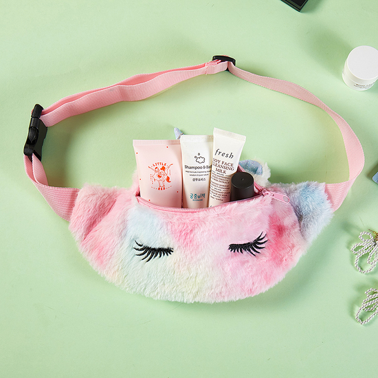 Front view of purple tie-dye unicorn chest bag with zipper and embroidered eyelashes.