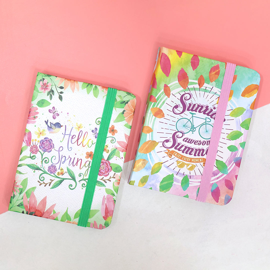 Decorative pocket-size notebooks with vibrant floral covers