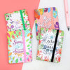 Compact colorful notebooks with elastic bands in seasonal prints