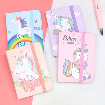 Assorted unicorn theme pocket notebooks with pastel covers and elastic bands