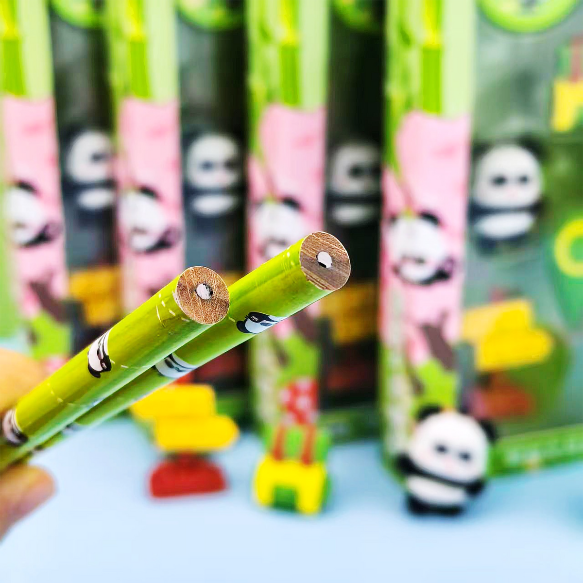Close-up of green bamboo-printed graphite pencils from the Kawaii Panda Stationery Set.