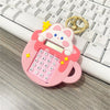 Cute mini pocket calculator keychain shaped like a pastel pink teacup with an adorable cartoon cat peaking over it.