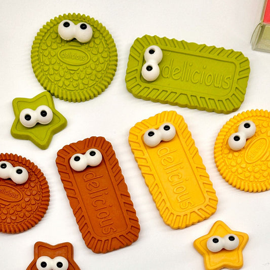Fun cookie-themed erasers for kids with adorable star and biscuit designs, packed in bright gift boxes.