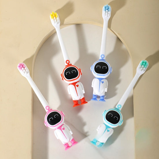 Kids astronaut-themed toothbrush with soft bristles and cute space design.