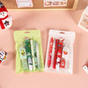Holiday stationery pack featuring Santa pens, Christmas tree pens, and mini corrector.