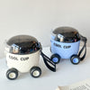Novelty rolling bus water bottle for children with clear dome lid.