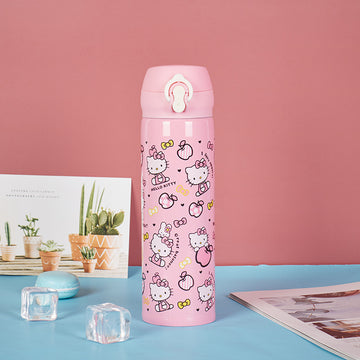 Cute Kitty-themed pink insulated water bottle with one-touch flip lid, surrounded by ice cubes and decorative items.
