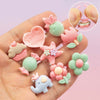 Kawaii children’s jewelry ring set with colorful resin designs.