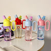 Pastel color kids’ water bottles with handles and fun cartoon toppers