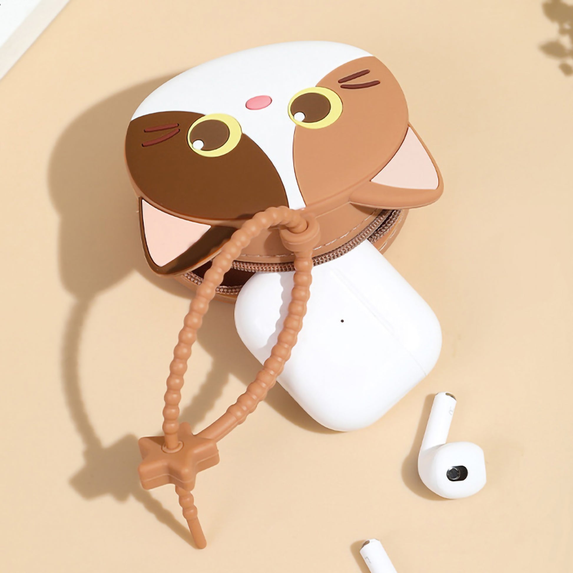 Cute silicone kitten coin purse earbud pouch with a star hanging loop strap.