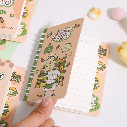 Small pocket-sized Puppy Coffee notebook with elastic closure