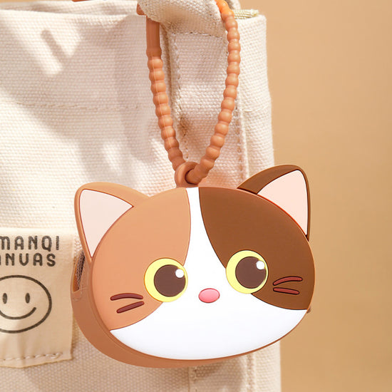 Premium flexible silicone cat theme wireless earphone case being wiped clean with a white tissue paper.