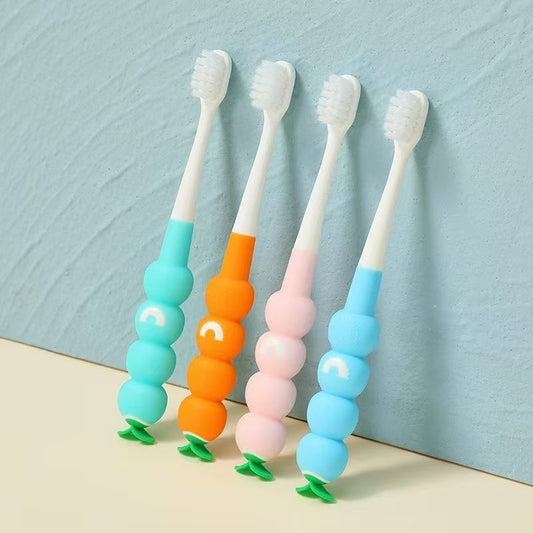 Kids toothbrush with soft bristles and caterpillar-style bubble grip handle.