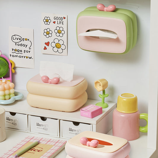 Durable plastic tissue box in soft pastel colors for home storage.