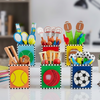 Colorful desk organizers with sports-themed items on a desk.