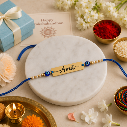 Close-up view of the gold nameplate reading  flanked by blue evil eye beads and white-gold beads on a teal and cream traditional setup.