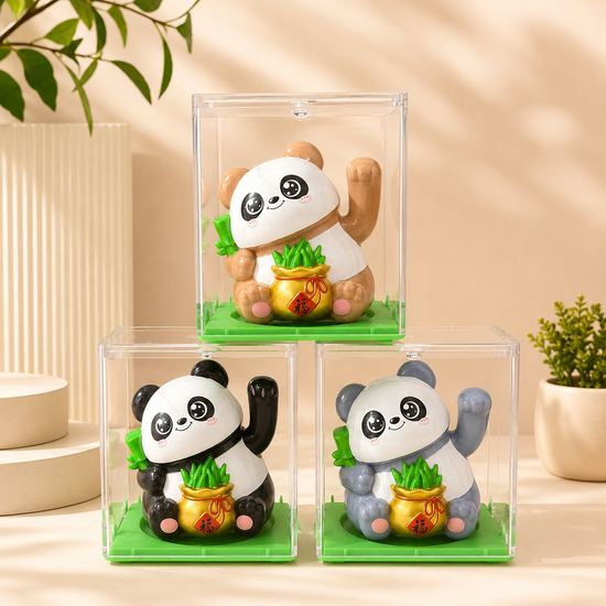An assortment of three mini solar-powered waving lucky panda figurines in clear display cases showing brown, black, and grey.