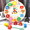 Round wooden educational clock toy featuring colorful shape blocks and a penguin illustration.