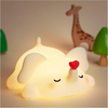 Loving Elephant silicone night lamp glowing softly on a bedside table