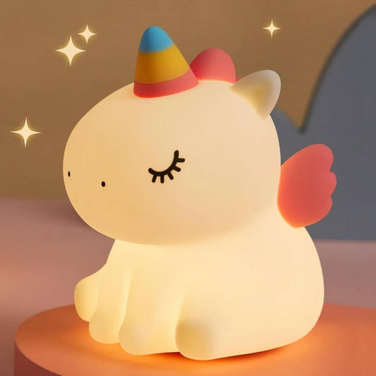 Cute sitting unicorn silicone night lamp glowing warmly